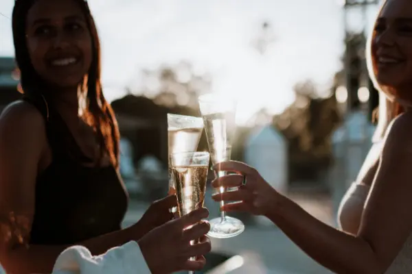 Ladies drinking champagne in the sun